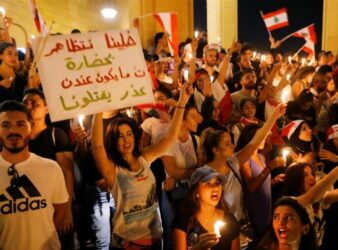 A sign that reads "Let us protest in a civilized way so that you don't have an excuse to kill us."(Mohamed Azakir/Reuters/Al Jazeera) violent in the Lebanese protests