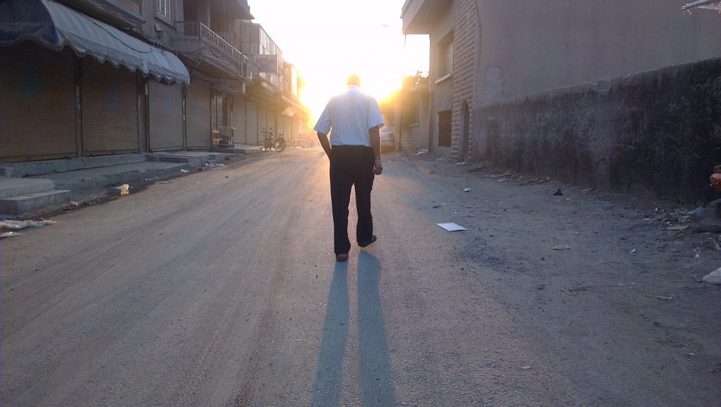 Man walking in Raqqah | August 2012. (Beshr Abdulhadi)