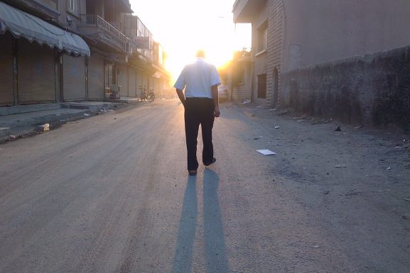 Man walking in Raqqah | August 2012. (Beshr Abdulhadi)