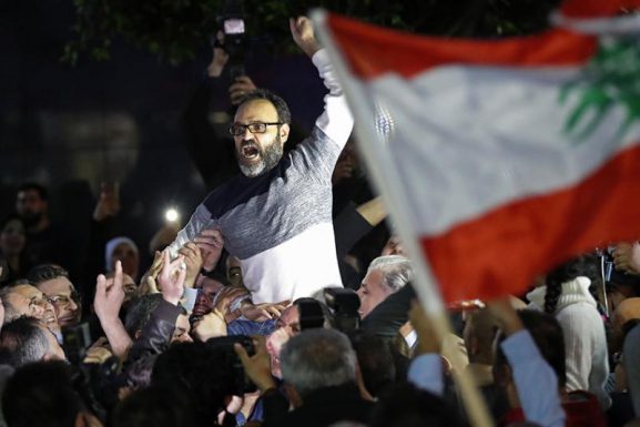 Lebanese actor Ziad Itani being carried after his release in 2018. (AP Photo | Hussein Malla)