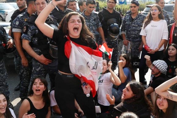 A university student gestures during an anti-government protest in Beirut. (Goran Tomasevic | Reuters)