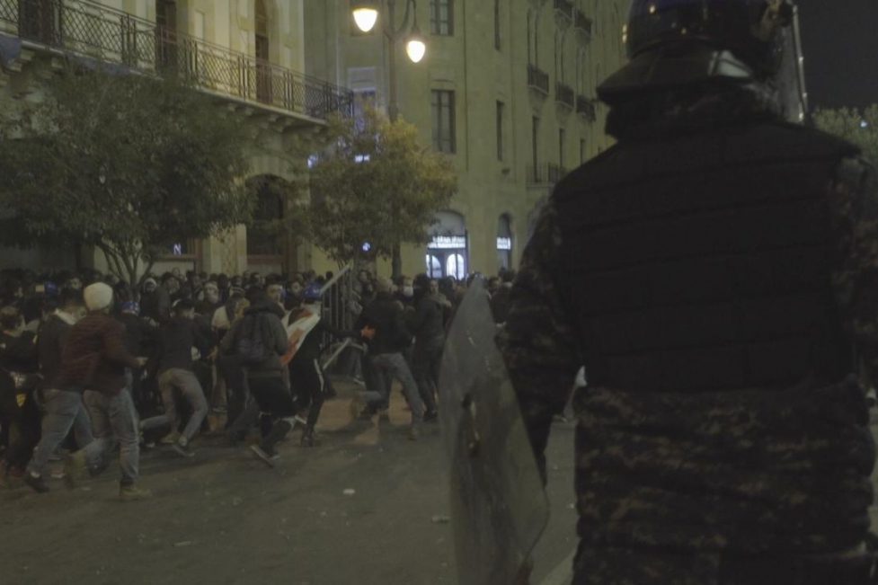 Protesters in Beirut run from Internal Security Forces on Sunday, December 15. (Lujain Jo)