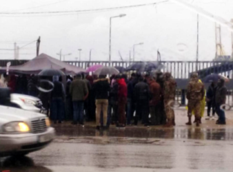 Protesters gather outside the port of Tripoli on Thursday, January 2. (NNA) Ports article