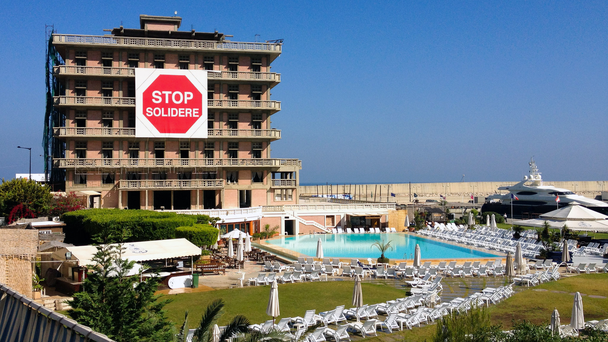 A giant "Stop Solidere" sign drapes over the St. Georges Hotel for all to see. (Allan Leonard)