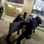Anti-government protesters break the window of a bank in Beirut. January 2020. (Marwan Tahtah / AFP / Asia Times)
