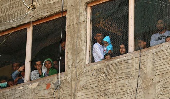 Syrian refugees in a building under construction they have been using as a shelter in the city of Saida, March 2020. There are rising fears that refugee communities are at an increased risk of getting COVID-19. (AP / Al Arabiya)