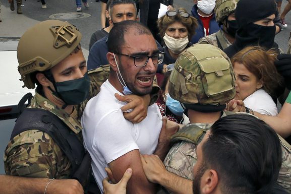 Clashes between the Lebanese army and protesters in Zouk Mosbeh, Lebanon, one of the many locations where demonstrators are demanding their basic rights as Lebanon’s economy crashes and the price of basic goods rises. (Photo: AP / Bilal Hussein) Tripoli article