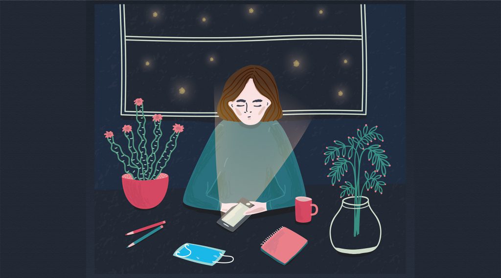 Illustration of woman sitting at a desk and using her phone at night with a facemask in front of her. For Speak Up COVID article