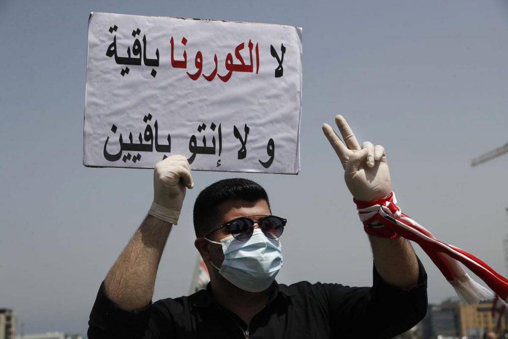 "Neither coronavirus nor you will last," reads this sign from a protester in Lebanon on April 24. (Photo: Lebanon Express via Hussein Malla / Ap) Lira plummet article