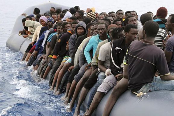 (PHOTO: Sputnik News via AFP / Abdullah Elgamoud) migrants and migration in Europe article
