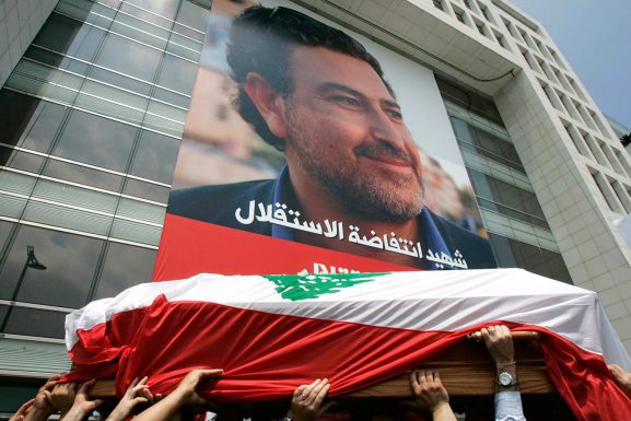 Friends and relatives carry the coffin of slain Lebanese journalist Samir Kassir in Beirut in June, 2005. (AP Photo / Hussein Malla)