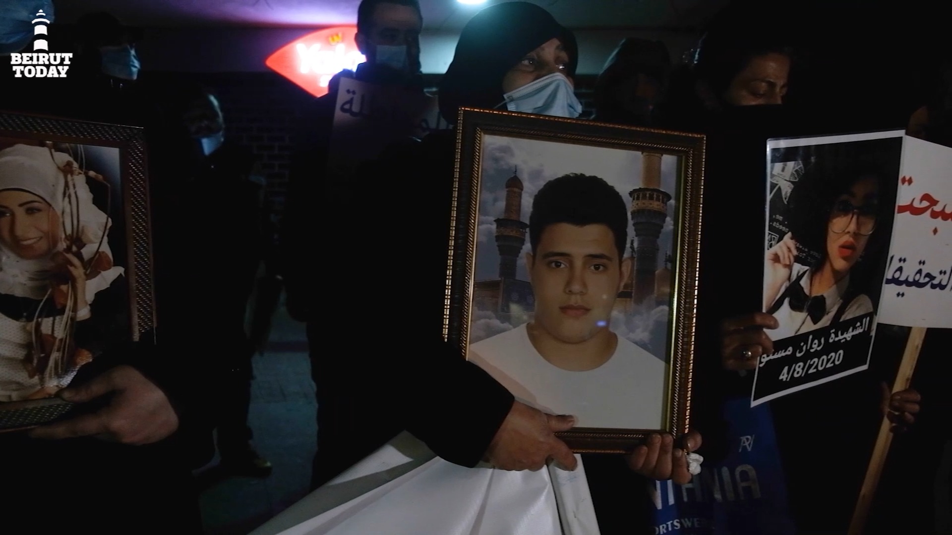 Families of victims of the Beirut port explosion clutch photos of their deceased loved ones as they protest the removal of Judge Sawan from the investigation on February 18, 2021. | Photo: Ghassan Mogharbel. Rage and anger article.