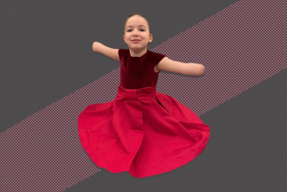 Ella Tannous in a pink dress against an abstract background