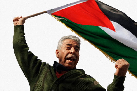 Older man waves a Palestinian flag in Sheikh Jarrah. Photo: flickr.com/photos/libertinus, taken on April 22, 2011.