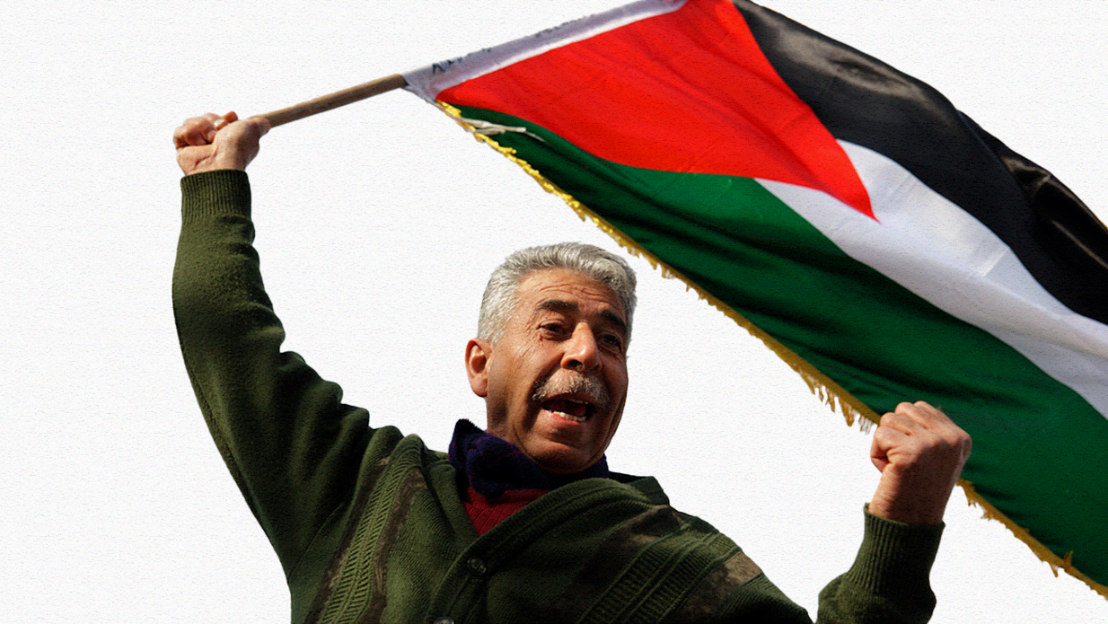 Older man waves a Palestinian flag in Sheikh Jarrah. Photo: flickr.com/photos/libertinus, taken on April 22, 2011.