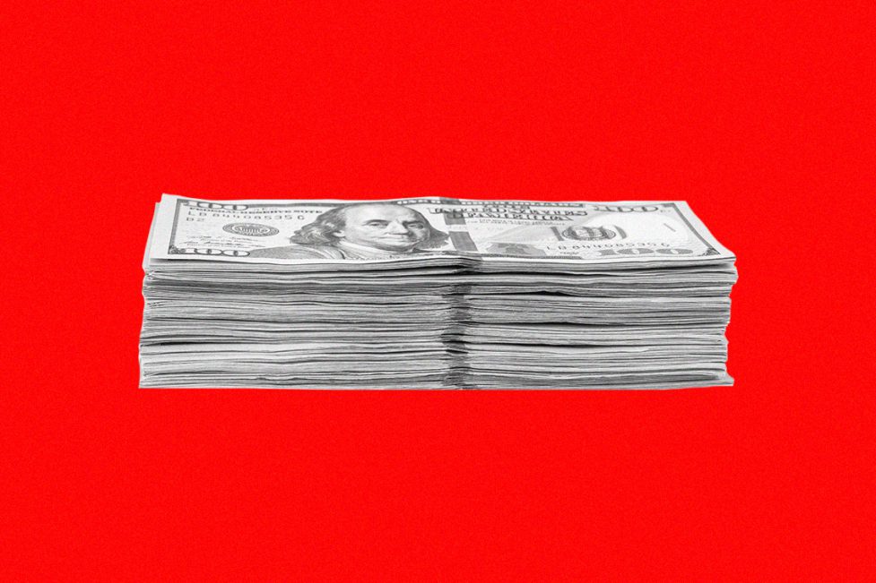 Stack of dollars against a red background