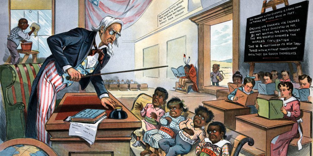 In this 1899 cartoon published, Uncle Sam lectures his new students: The Philippines, Hawaii, Puerto Rico, and, Cuba. Past and potentially future U.S. acquisitions fill the rest of the classroom.