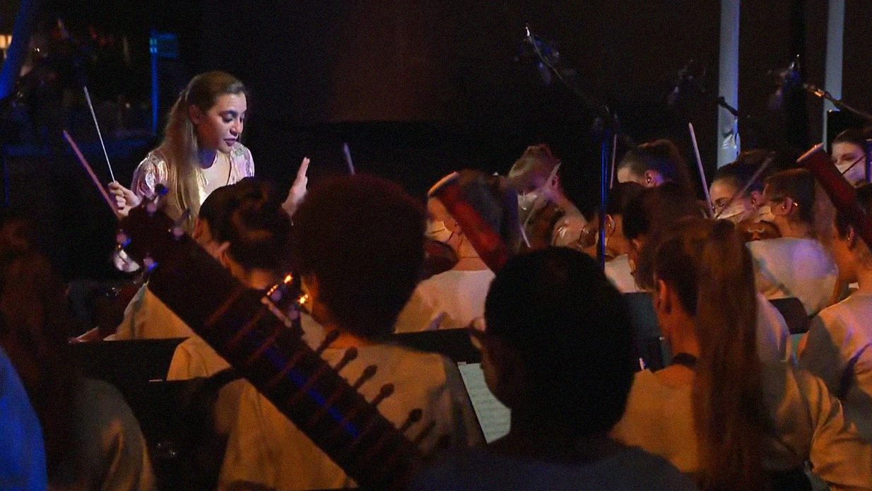 Lebanese conductor Yasmina Sabbah leads the Firdaus Women's Orchestra at the Expo 2020 opening ceremony.