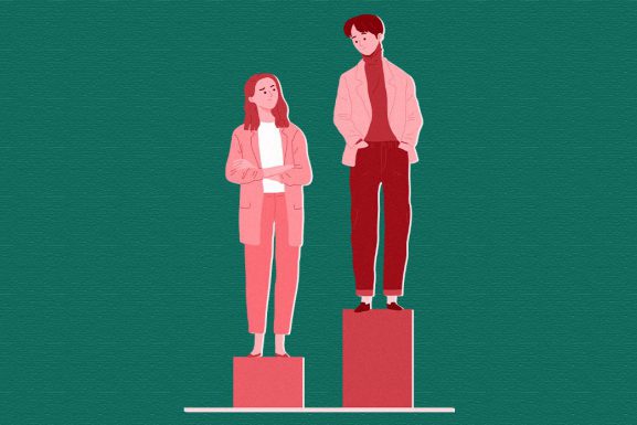 Illustration of man standing on top of a higher pedestal than a woman, who is looking up at him and frowning. ARTICLE: Breaking down Lebanon’s first gender statistical report