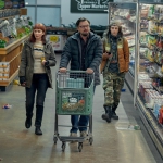 Still from Don't Look Up where Leonardo DiCaprio, Jennifer Lawrence, and Timothée Chalamet are walking in a dishevelled supermarket.