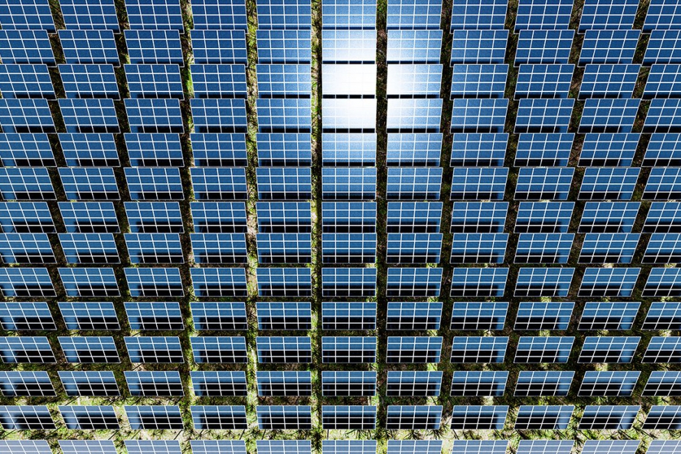 An aerial shot and 3D render of lines of solar panels