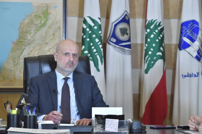 Interior Minister Bassam Mawlawi sits at his desk