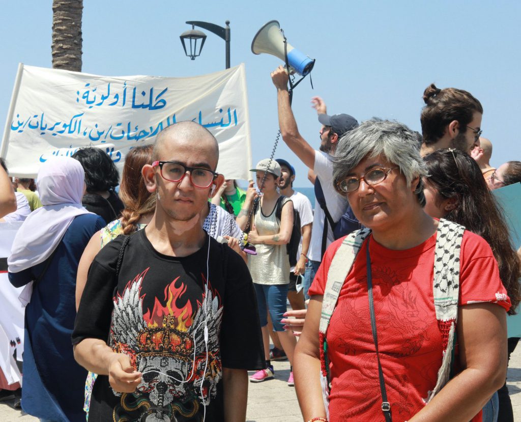 Two people are standing together during the march.